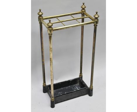 A VICTORIAN DESIGN BRASS FRAME STICK STAND with cast iron base, having removable drip pan, 62cm high 