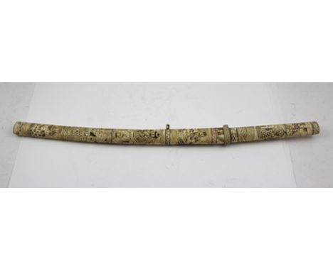 A JAPANESE SHORT SWORD, 43cm blade, c.1900 with engraved bone scabbard and grip 