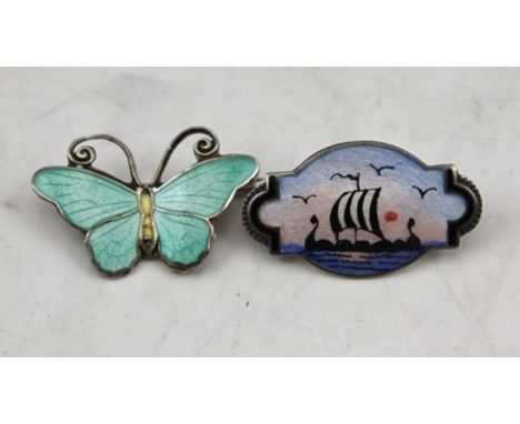 A NORWEGIAN SILVER AND ENAMEL BROOCH by Aksel Holmsen, depicts a longboat at sea, 1.5cm x 2.7cm, together with a SILVER AND P