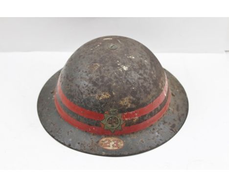 A "NATIONAL FIRE SERVICE" WORLD WAR II TIN HELMET bearing no.23, (believed Worcester district) and stencilled ref. no. inside