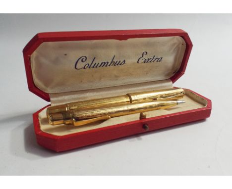 Vintage Italian gold plated pen set by Columbus Extra, comprising ink pen and pencil with engine turned decoration, in origin