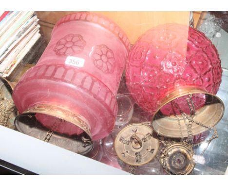 Three various cranberry glass light fittings 