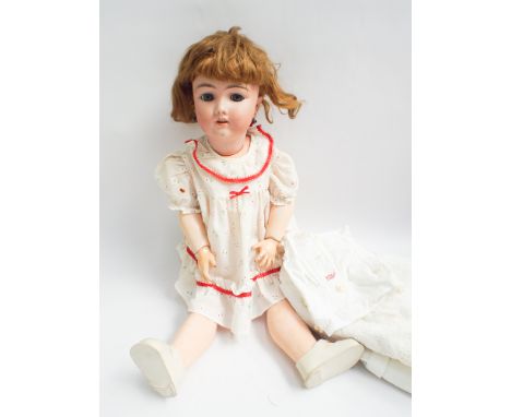 German bisque headed doll by Handwerck, composition body and articulated limbs 62cm tall   Condition - wig of doll is loose 