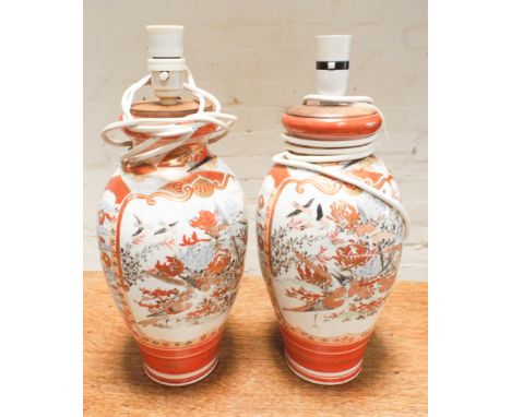 Pair of large Japanese satsuma vases decorated with figures and pagodas to one side and birds and flowers to the other,  Conv