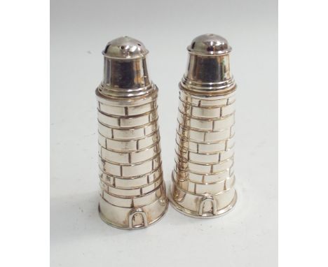 Pair of silver plated salt and pepper pots modelled as light houses, 10 cms high 