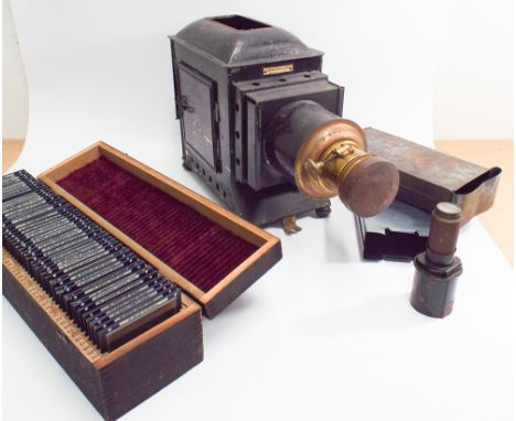 Victorian magic lantern in fitted box together with large qty of slides 