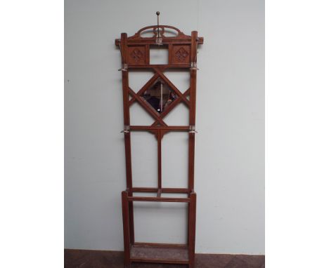 1930's oak hall stand with inset bevelled mirror panel, 5 coat hooks and a stick stand and drip tray under 