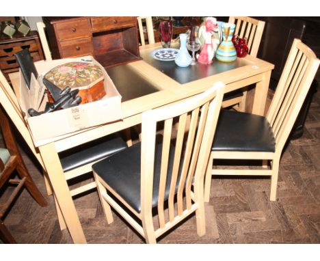 Light beech dining table with glass top and 6 matching slat back chairs with black seats 