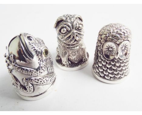 Three silver thimbles including sterling pug dog decorated example