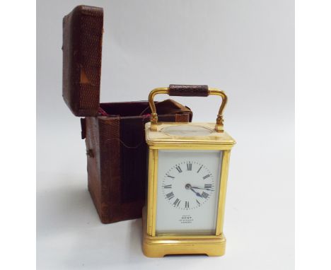 Brass and glass cased carriage clock by Dent of London 17cm high (including handle)complete with leather travelling case 