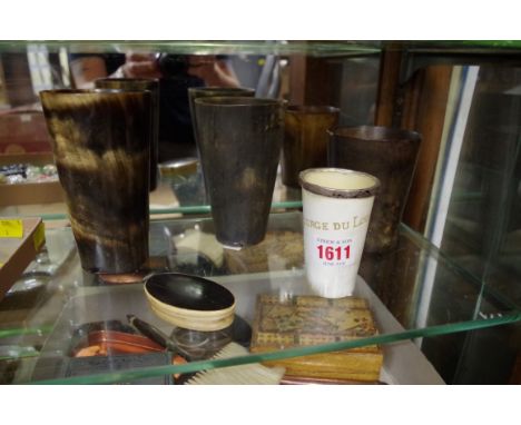 Four horn beakers and a horn snuff box.&nbsp; 
