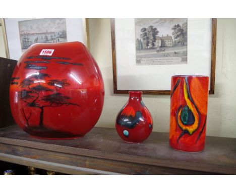 Three Poole pottery vases,&nbsp;to include an African Sky pattern example, 25.5cm high. 