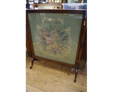 A circa 1920 mahogany fire screen, with gros point panel, 81cm wide.&nbsp; 
