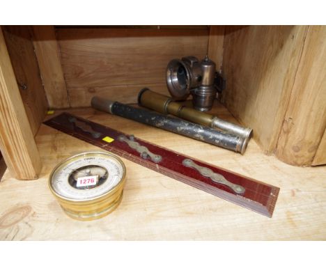 A mixed lot,Êto include: an aneroid barometer; a Lucas carbide lamp; a draughtsman's rule; and two telescopes, one by H Hughe