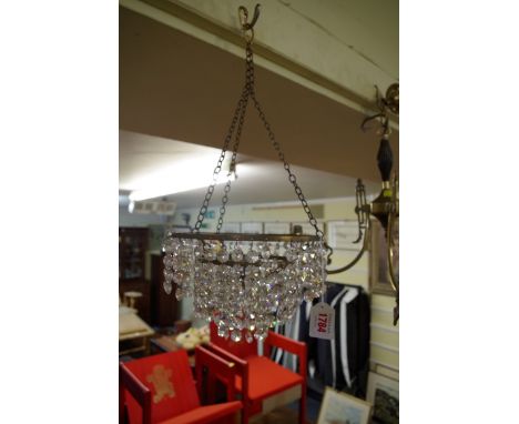 A small three tier chandelier;Êtogether with a brass three branch ceiling light. 