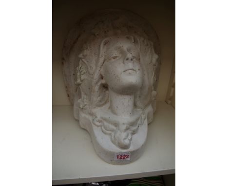 An Art Nouveau style white painted pottery wall bracket, moulded with a lady's head, 30cm wide. 
