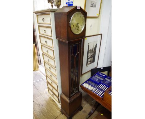 A 1920s oak small longcase clock,&nbsp;136cm high.&nbsp; 