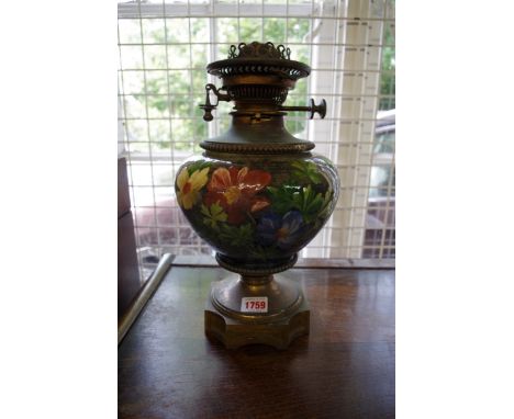 A Victorian pottery and brass oil lamp. 