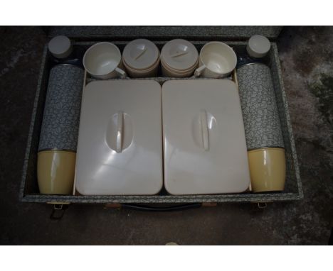 A 1950s/60s picnic hamper,Êcomplete with contents. 