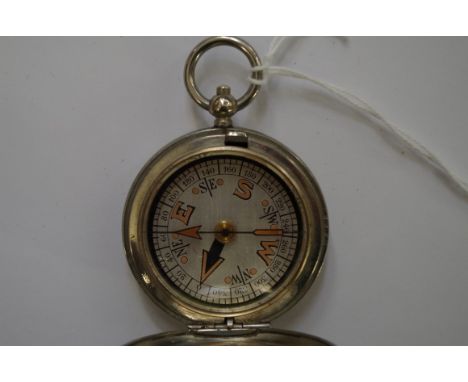 A World War I period pocket compass,Êby Dennison, with broad arrow stamp and dated 1917. 