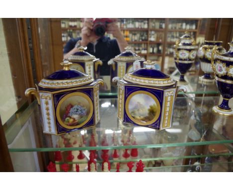 A pair of Royal Worcester twin handled rectangular boxes and covers, circa 1913,Êone by W A Hawkins, the other Harry Davis, 1