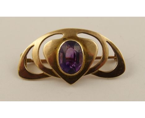 A 9ct Art Nouveau brooch set with an amethyst, approx 35mm x 19mm.