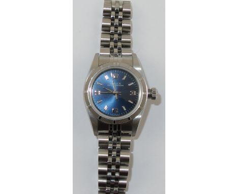 A ladies Stainless steel Rolex Oyster Perpetual with brushed blue metallic dial, silver coloured baton hands with sweeping se