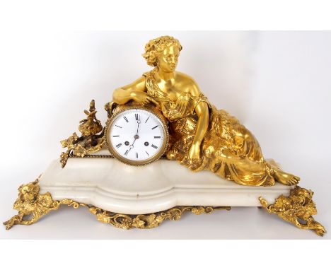 A mid to late 19th Century figural mantel clock by the Japy Freres, Paris.  The marble base with ormolu figure of a female in