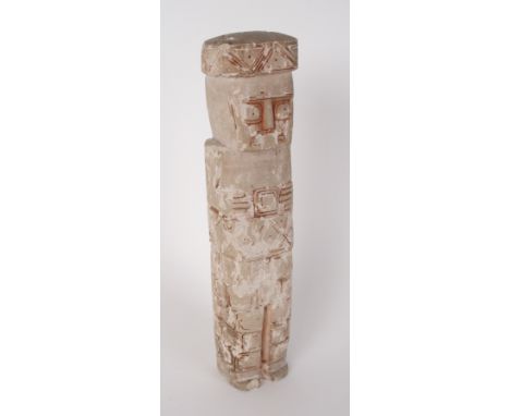 A carved sandstone statuette of squared form with glyphic design typical of Mayan influence, 20cm high