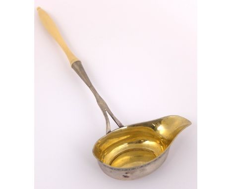 A silver punch ladle unknown marks, the oval bowl with engraved decorated rim, the slender stem with ivory handle, 27cm long