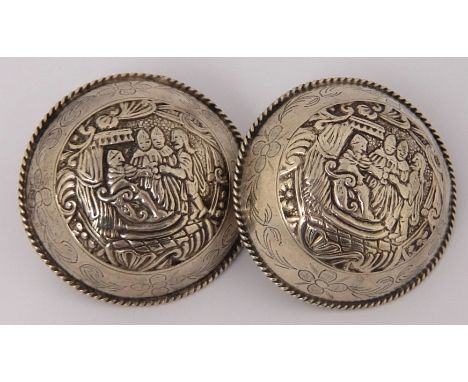 A pair of cloak buttons maker's marks GV & DV, no hallmarks, of domed circular shape with ropework rim, embossed with three f