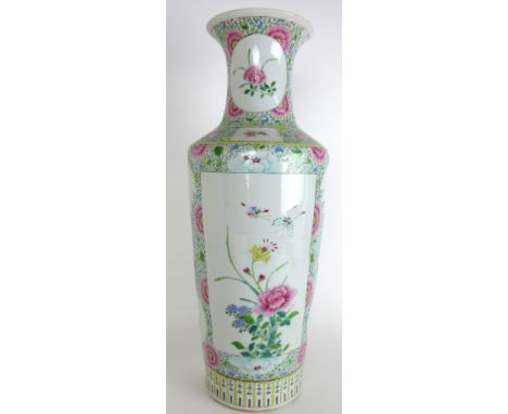 A Chinese famille rose cylindrical vase painted with panels of insects and flowers, divided by leaf and roundel shaped panels