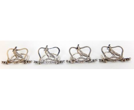 A set of four Edwardian silver placecard holders by Brook & Son, Edinburgh 1901, each mounted with a dove on a branch with an