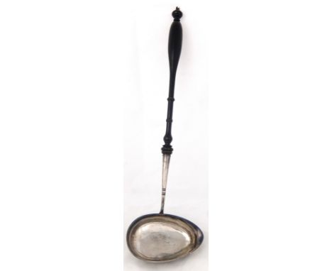 A punch ladle maker's marks R.B.P. unclear hallmarks, the plain oval bowl with lipped and turned wood handle, 46cm long