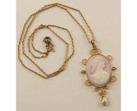 A pink and white shell cameo  of a maiden in profile, in 9ct scrolled mount set with a blister pearl and split pearls on a fi