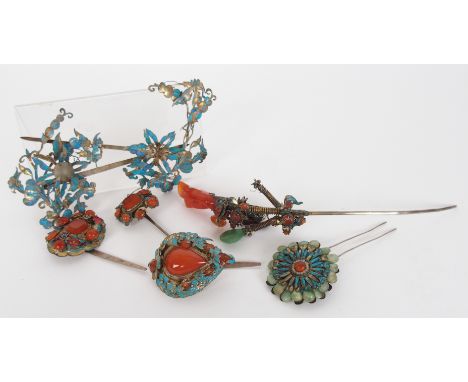 Seven Chinese silver gilt enamel and gem set hair pins of foliate form, largest 17cm long, smallest 4.5cm long (7)