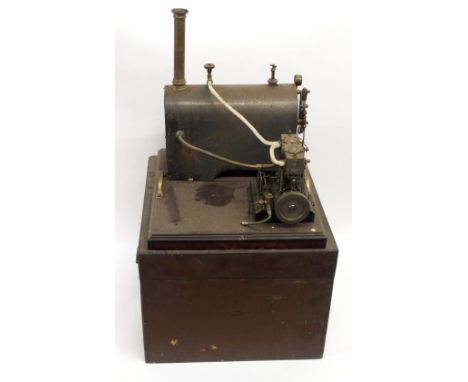 A model live steam engine with twin cylinders and horizontal boiler with brass chimney on wooden base and case Property from 
