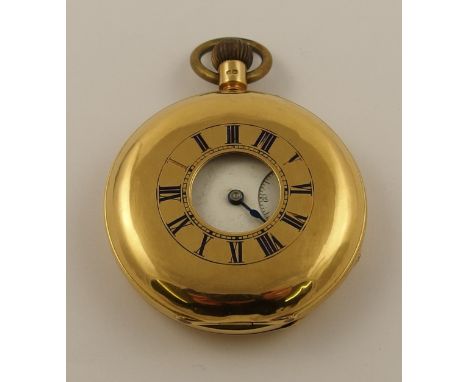 An 18ct half hunter pocket watch with blue enamelled chapter ring surrounding the aperture, white enamel dial with black Roma