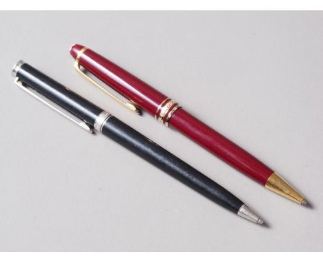 A crimson cased Mont Blanc roller ball pen and a similar black cased Mont Blanc roller ball pen 