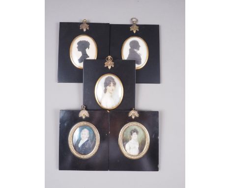 Two early 19th century portrait miniatures of a woman and a man, in ebonised frames, two prints of silhouettes and another si