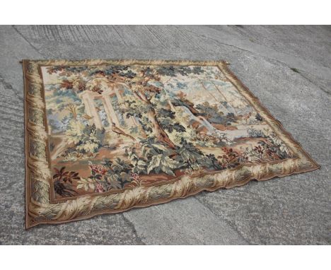 A  Jacquard woven verdure tapestry wall hanging, decorated classical ruins in woodland, 65" x 84" approx 