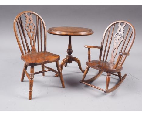 A miniature elm Windsor wheel rocking chair, 5 3/4" high, a similar Windsor wheelback chair, 6 1/2" high, and a mahogany and 