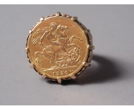 A gold 1926 sovereign, in yellow metal ring mount, size R, 15.2g overall 