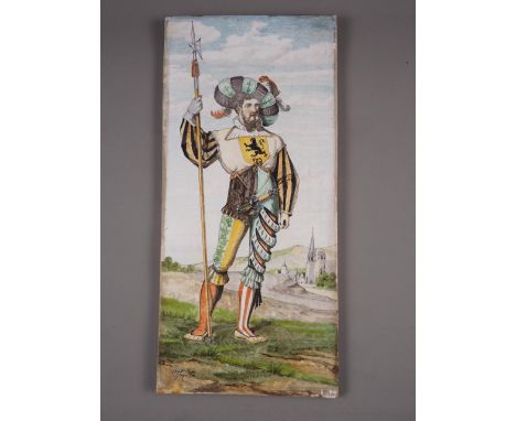 A French earthenware tile, decorated with a Swiss mercenary, indistinctly signed lower left, 24" x 11" 