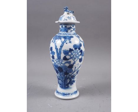 A Chinese blue and white baluster vase and cover with tree and foliage decoration and Dog of Fo finial, 8 3/4" highThe unders