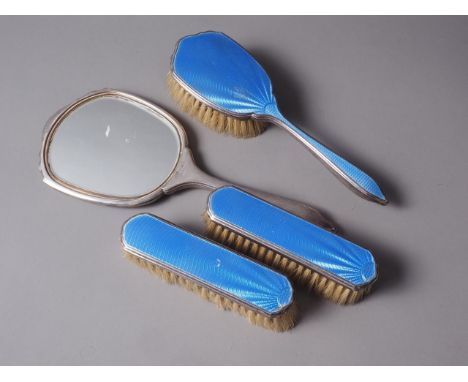 A silver and blue enamel four-piece dressing table set 