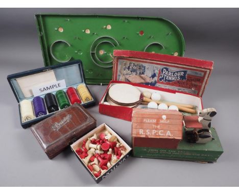 A quantity of vintage games, including an early 20th century "Parlour Tennis" game, in box, poker chips, a leather bridge box