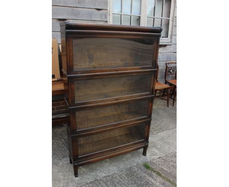 A dark oak Globe Wernicke four-section library bookcase, 34" wide x 10 1/2" deep x 56" highCondition:General wear and tear co