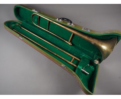 A Skylark brass trombone, in case, a miner's safety lamp, by Thomas Williams, and a hammered pewter cased mantel clock 