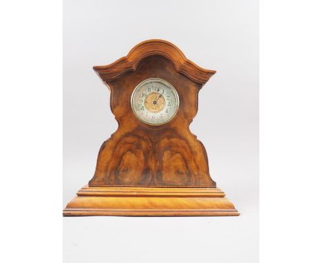 An early 20th century figured walnut shape top mantel clock with gilt dial, 10 3/4" high, and an early 20th century mahogany 